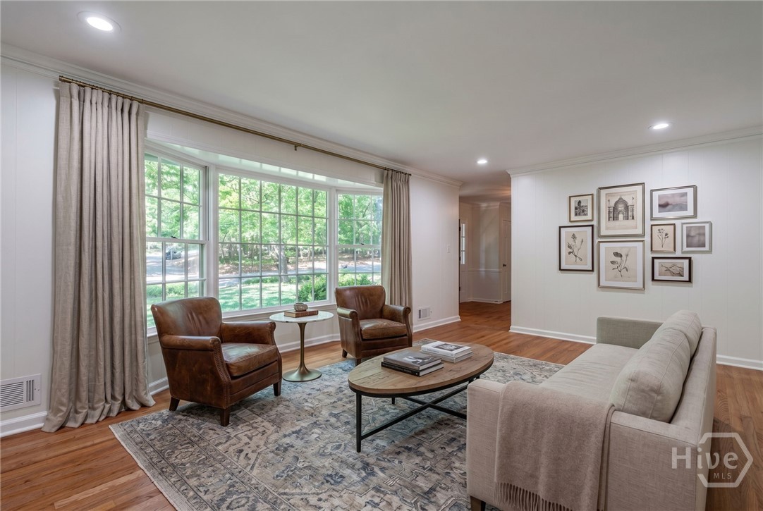 Living Room: Sun-drenched living space anchored by