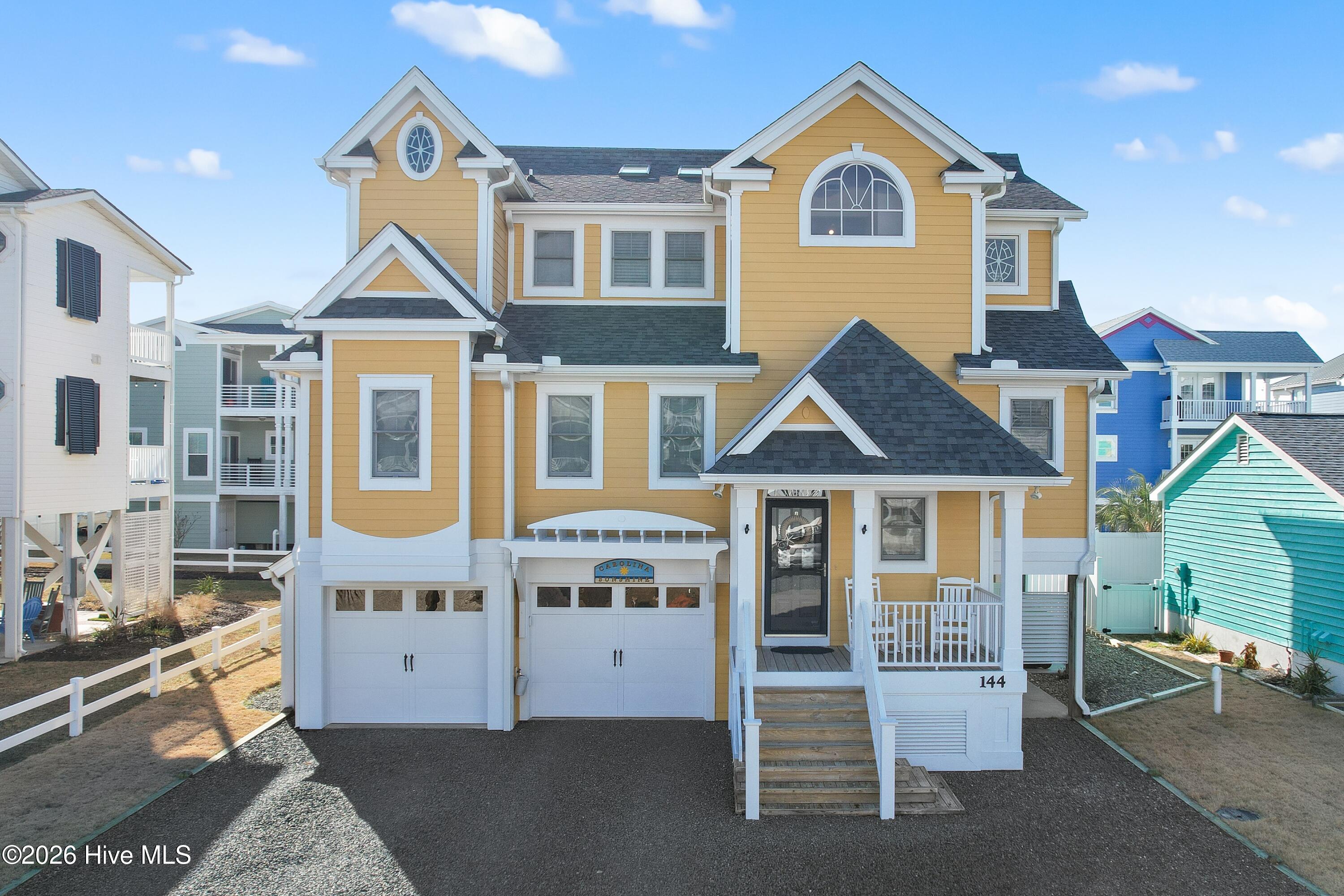 Coastal elegance at its finest! Welcome to 144 Carolina Avenue, a custom built home located on award winning Holden Beach. Located near the heart of Holden Beach you will find this home offers immediate access to town amenities that include: public boat ramp, pickleball/basketball courts, concert area, and much more. A public beach access is a short distance away making a day at the beach that much easier to accomplish. & for the days where the beach may be too much, soak up the sun by the pool in the backyard or relax on one of the two large back decks. Inside you will find a well maintained home offering ample space to maximize your comfort. Upon entering, you'll notice that the floors are true hardwood through the main living area, kitchen, and stairs. The main living area greets you as you enter the second level. Kitchen to your right equipped with ample cabinet and countertop space boasting gorgeous granite countertops. All appliances are stainless, installed in '25. Kitchen island with electric cooktop offers extra seating separate from the dining area. Main bed/bath are just off the living room offering tons of space along with his and her closets. Main bathroom is equipped with tile flooring offering dual sink vanities and walk-in tile shower. Take the elevator or the stairs to the third level where you will find the second living space separating the two guest bedrooms. Each guest bedroom is well sized and offers spacious closets and rarely, each bedroom has its own bathroom checking another box off the list. All the way downstairs on the main level you will find the pool room offering added space to relax by the pool as well as a two car garage with plenty of space to park your vehicles and store tools out of the elements. All in all, this home is sure to please. Offering elegance with a coastal charm. The perfect second home or permanent residence if you are looking to relocate to Brunswick County. Make this home yours to enjoy before summer gets here!