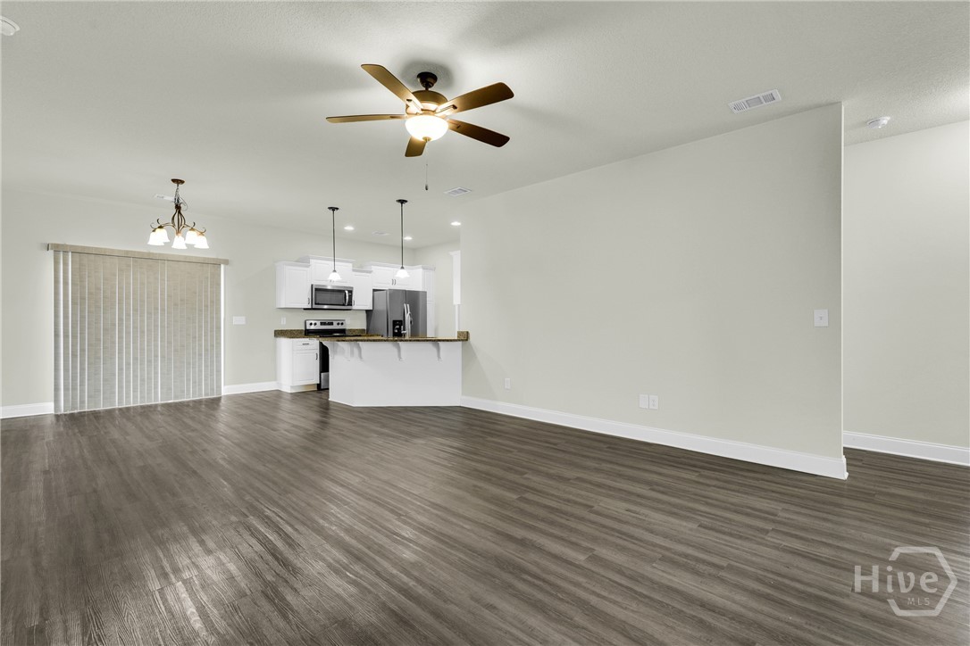 Open concept living and dining area conveniently c