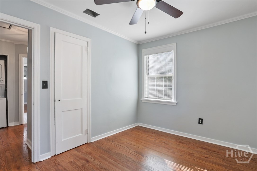 Hardwood floors and lighted ceiling fan.