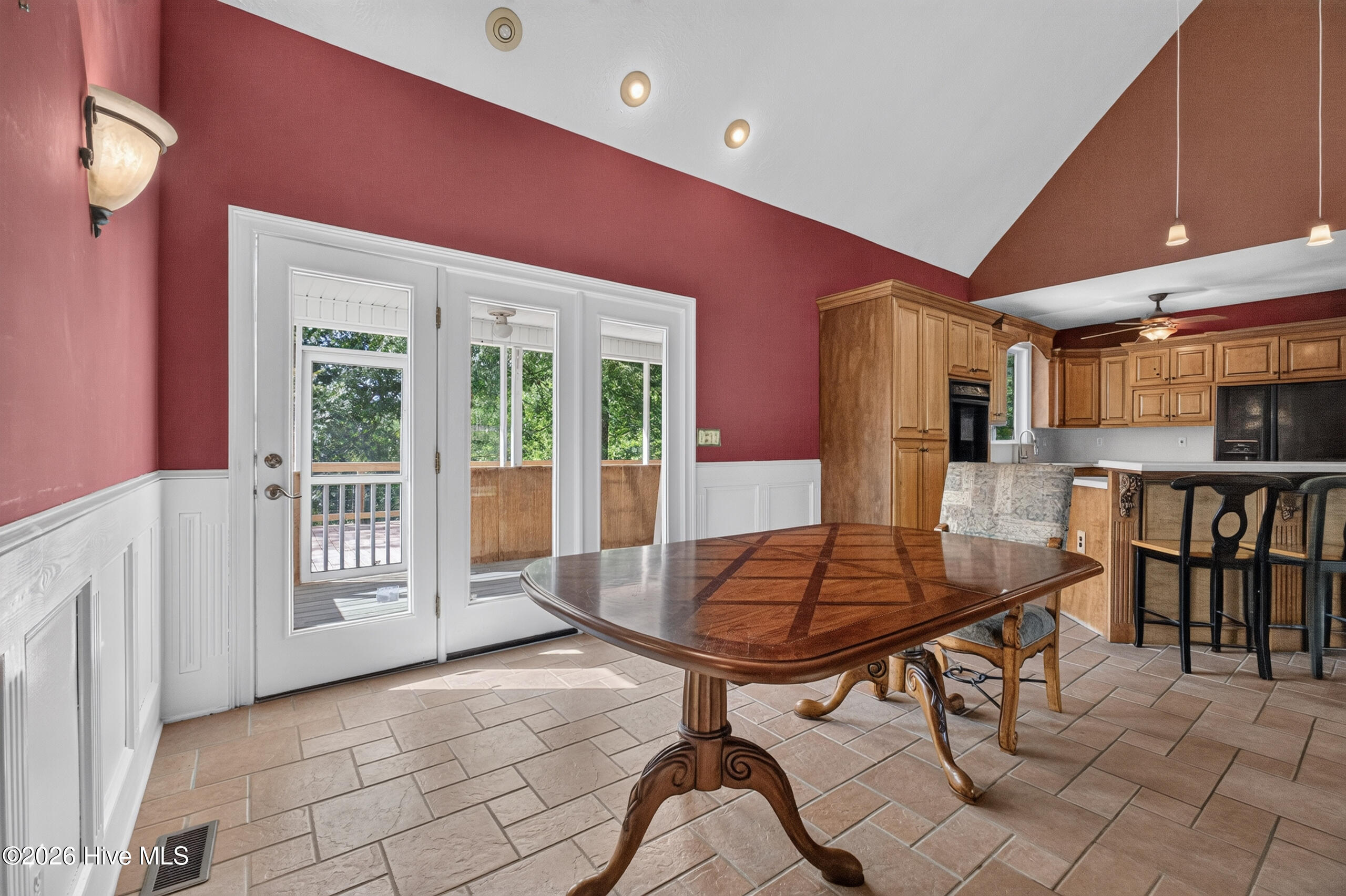 Spacious dining area, French door leads to screened porch