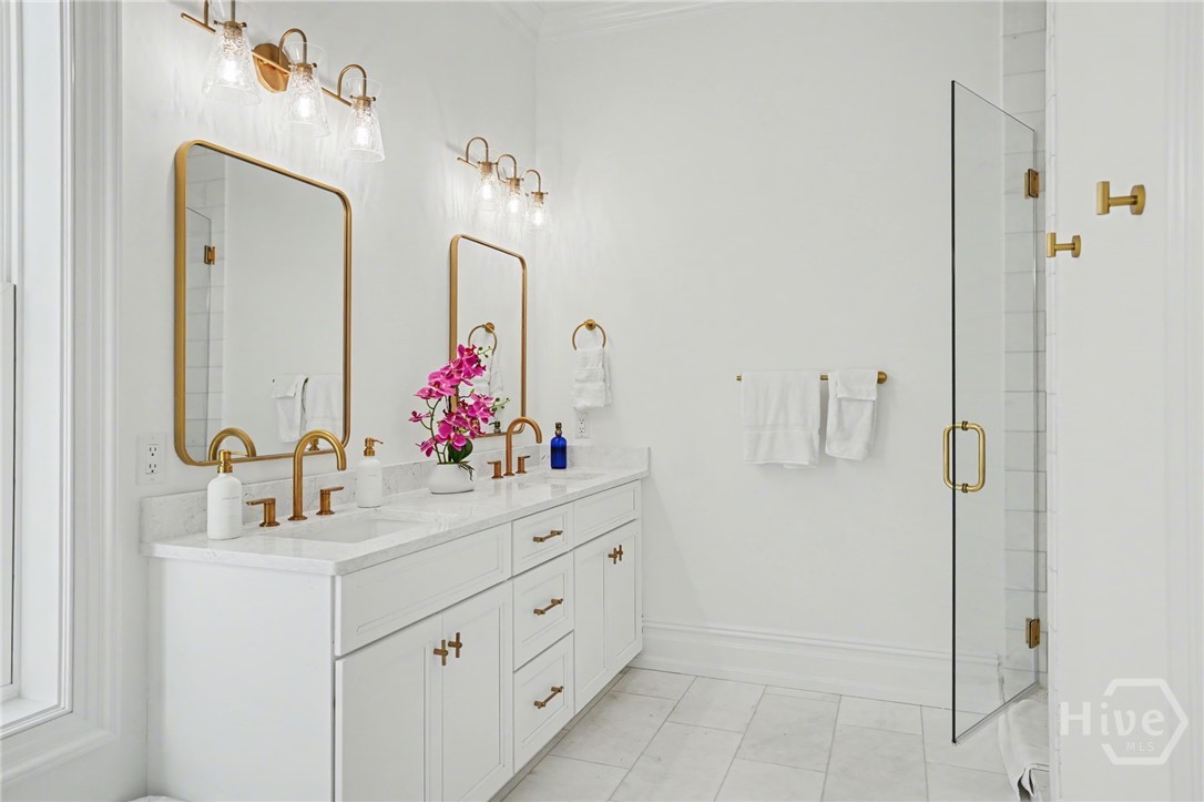 Primary Bathroom with Dual Vanity, spacious shower and private water closet.