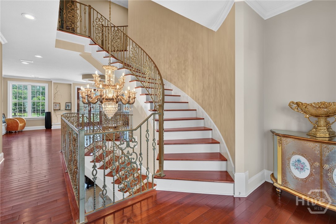 On 2nd floor, staircase to 3rd floor. Balcony overlooking driveway directly opposite. Note drywall issue on wall in the back