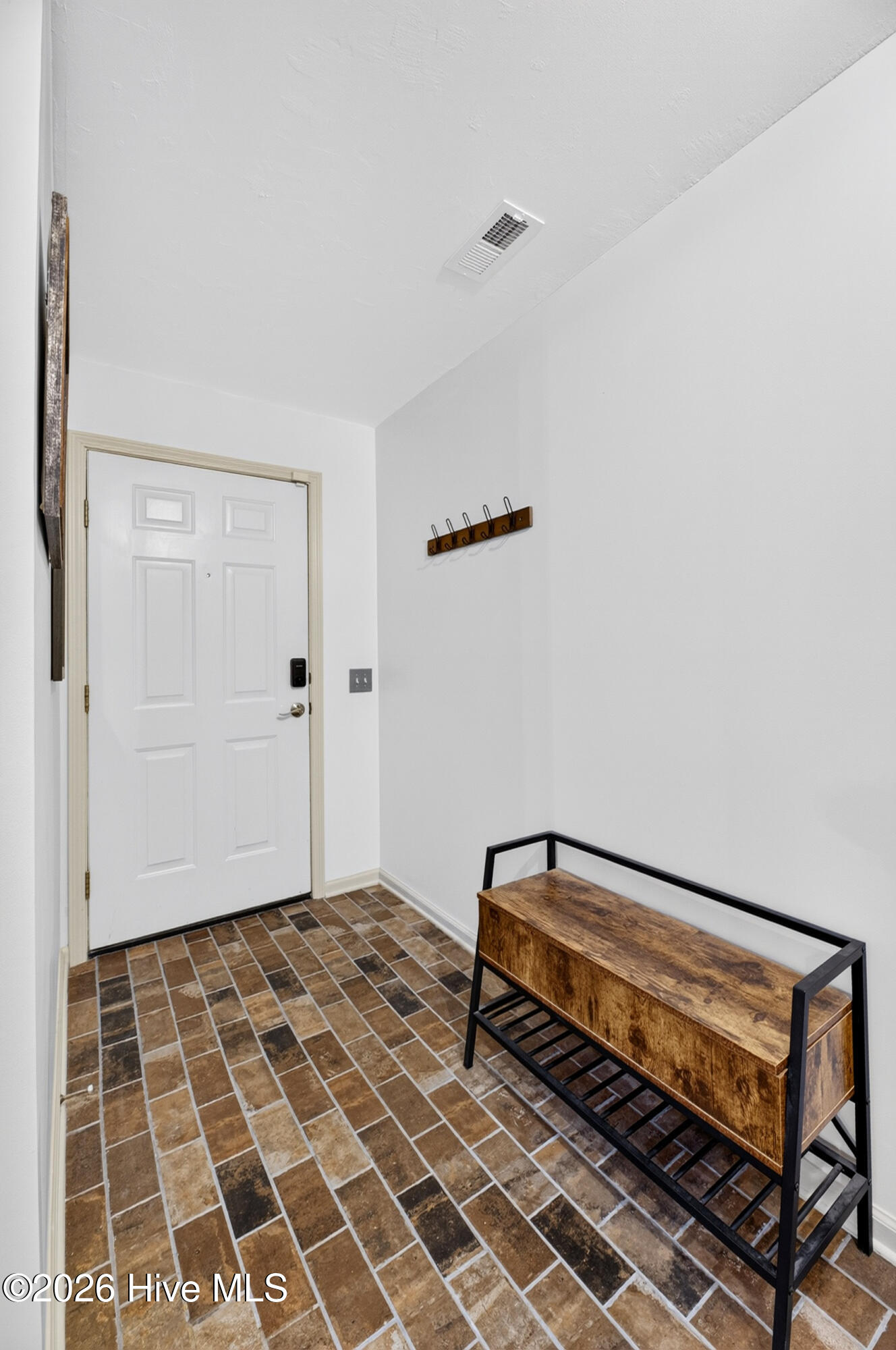 Foyer separates entry from living