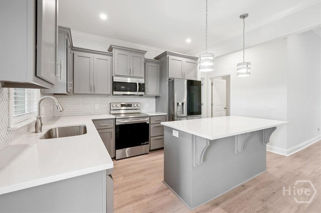 Kitchen with abundant real wood cabinetry.