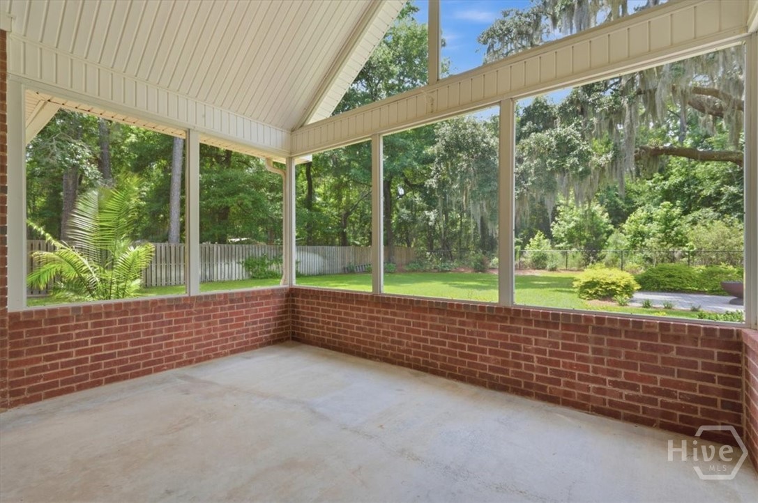 Screened back porch with vaulted ceiling.