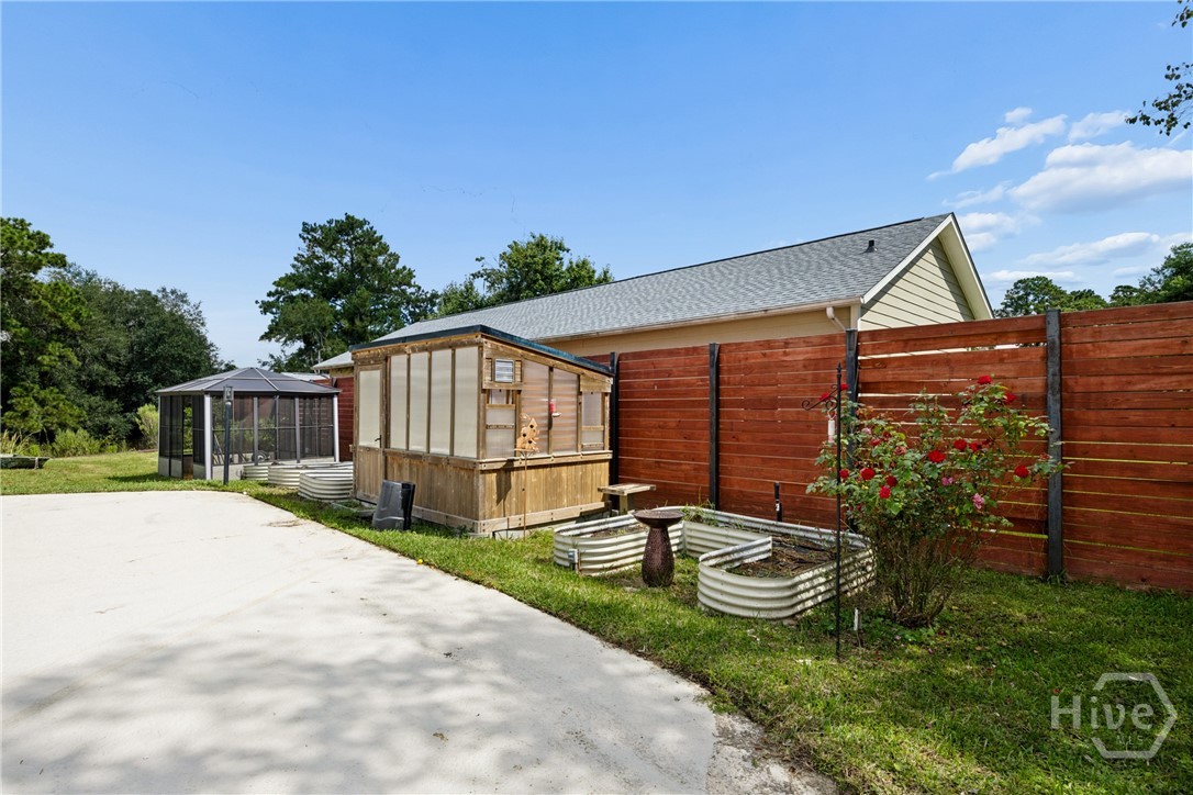 Well-kept gardening area, perfect for different varieties of herbs, fruits, vegetables, and more.