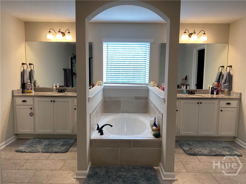 Primary bathroom with garden tub and separate vani