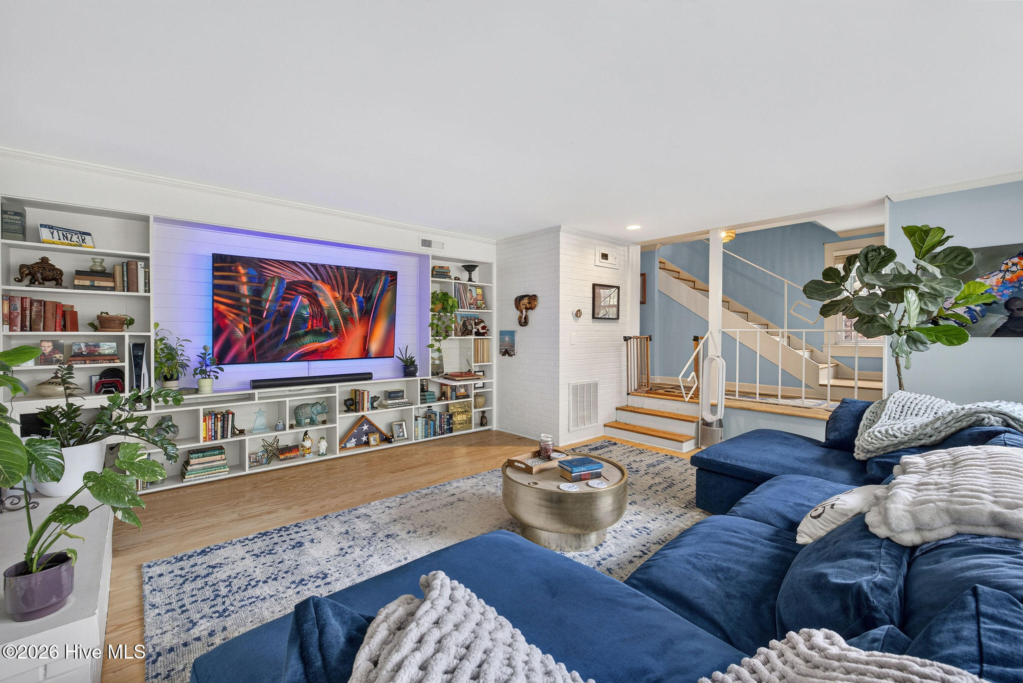 Living Room with built-ins for books and electronics.
