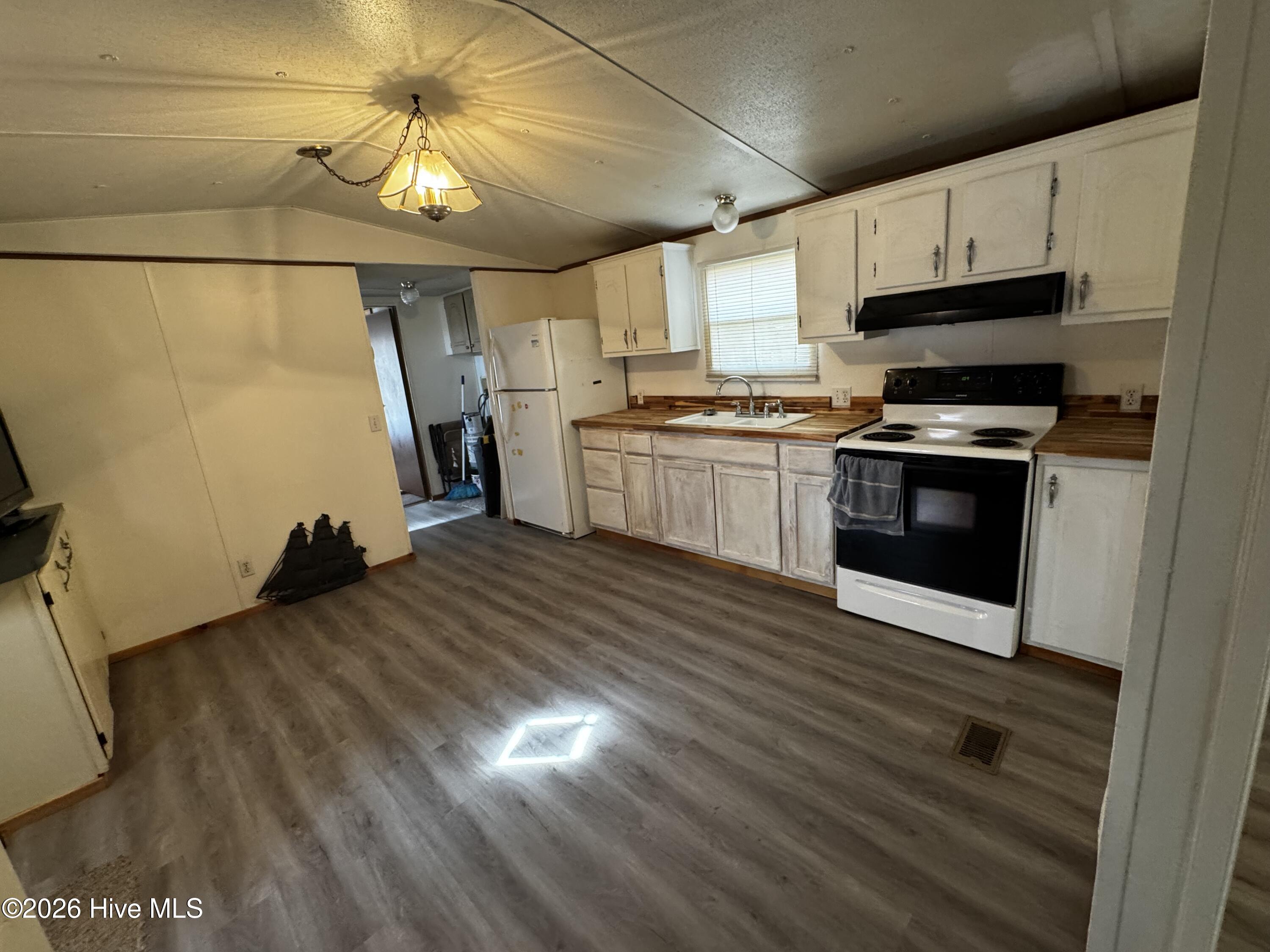 Kitchen with updated plank flooring