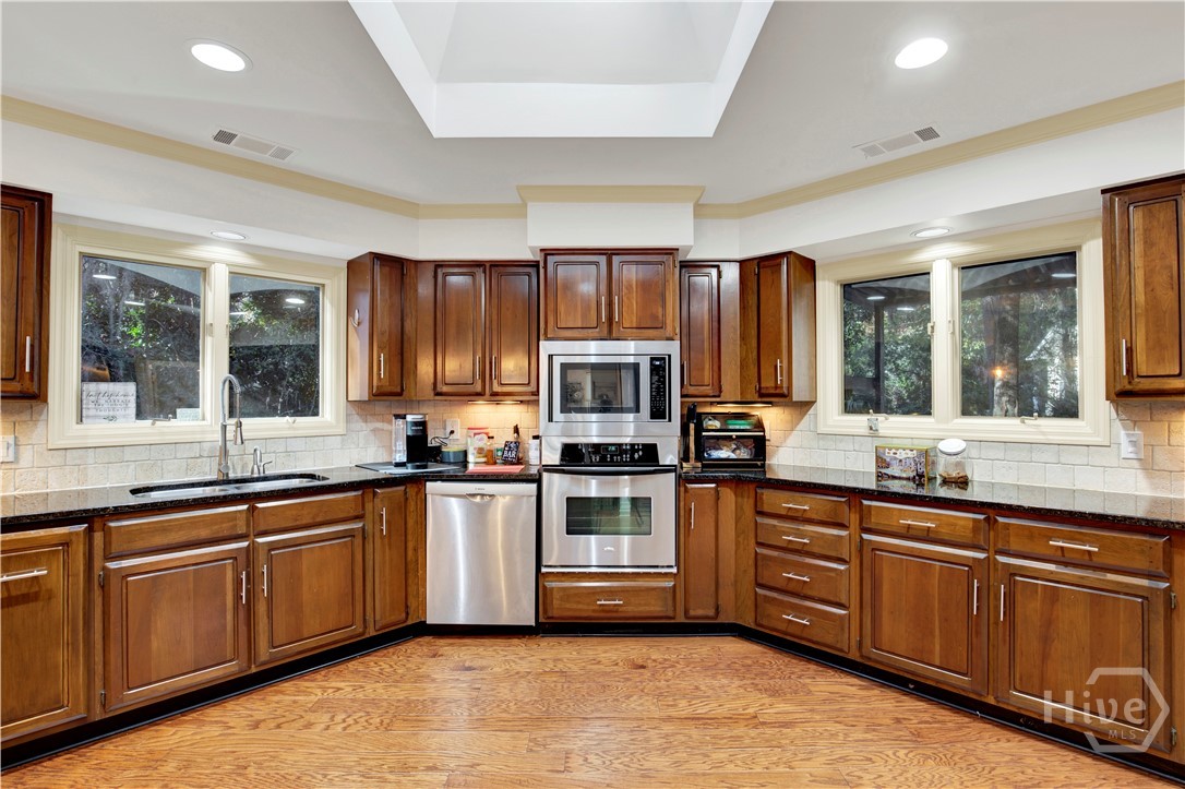 Granite counters, stainless appliances, beautiful cherry cabinets and plenty of storage space!