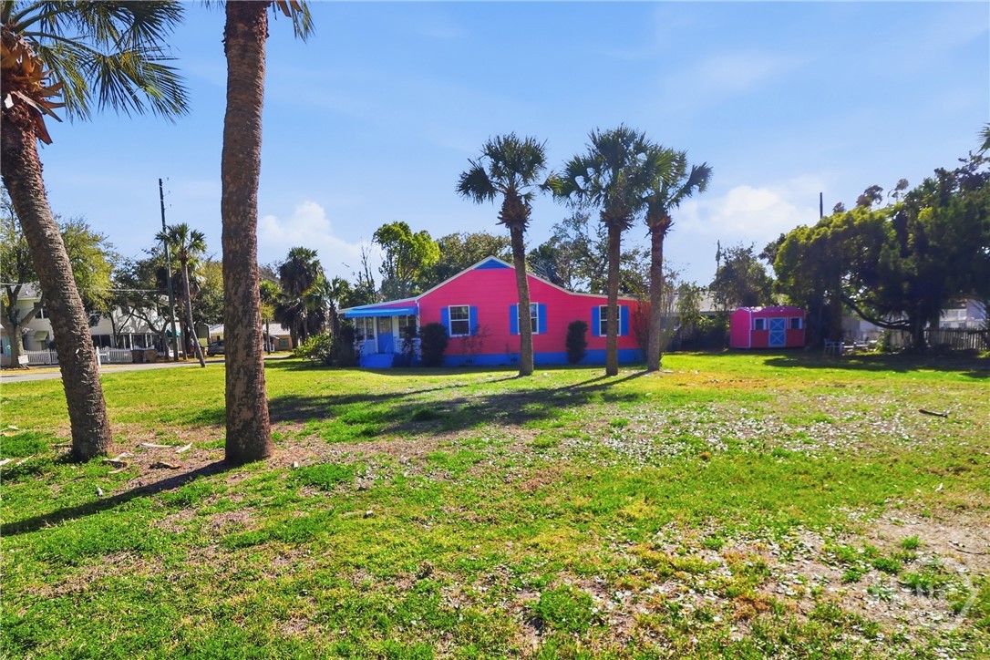 PALM TREES AND MATCHING STORAGE BUILDING.