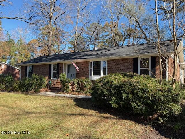 HAVELOCK - 4 BEDROOM LUXURY!  - A large, gracious brick executive home, with a modern finish artistically incorporated to perfectly blend tradition with a modern, stylish flair. Expertly updated, reimagined and finished with inspiration - You'll feel like it's practically NEW! The floor plan is adaptable to any lifestyle with lots of open space, storage and a floor plan which circulates efficiently. The formal living room has a beautiful box bay window that overlooks the sunny front lawn as does the dining room. The family room is open, with a dedicated entrance and a cozy fireplace to enjoy! There is so much recent work to admire, ALL COMPLETED IN LATE 2025! Many features include:  New luxury vinyl plank flooring throughout - New stainless kitchen appliances- New QUARTZ counters which coordinate with the new contemporary cabinetry - New water heater - New light and fan fixtures - New heat pump - New guest bathroom finish - New doors, windows, black doorknobs & handles...The list goes on and on!! The gourmet kitchen is amazing, feeling ever the larger as it opens into the family room. An adjoining mud/utility room with storage is also your side-entry foyer to the glorious master wing! It will be your private haven with its new luxurious master bath. It features a large tiled walk-in shower and standalone tub, triple closets & new slider inviting you into the very large backyard! It is fenced and has an extensive patio area - gentrified, private and peaceful! Such a great spot to enjoy the shade from the mature trees. Your workshop awaits in the detached 24' x 24' garage with its new vehicular and side entry doors. The quiet streets are a perfect spot for walks and bike rides, too. Freshly painted inside and a NEW ROOF! Take a look soon at this great investment opportunity with its countless new features... You won't want to miss your chance to live the ''Good Life''!!