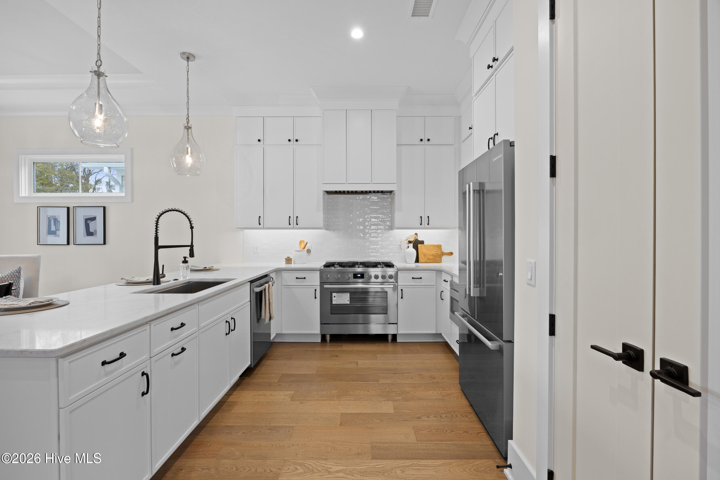 Kitchen with dishwasher, quartz counter tops, natural gas oven