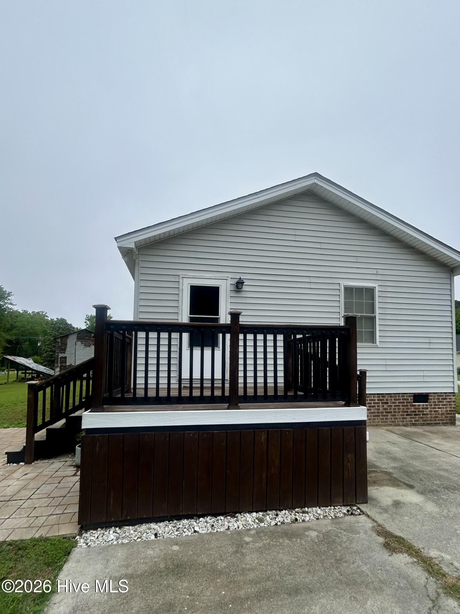 12 x 12 side pitching leading to driveway and q16 x 16 patio