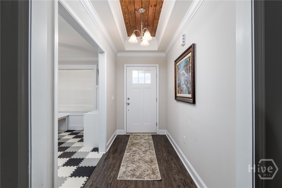 Note: the checkered pattern is an interlocking foam play mat in the front flex room / office. The flooring is LVP.