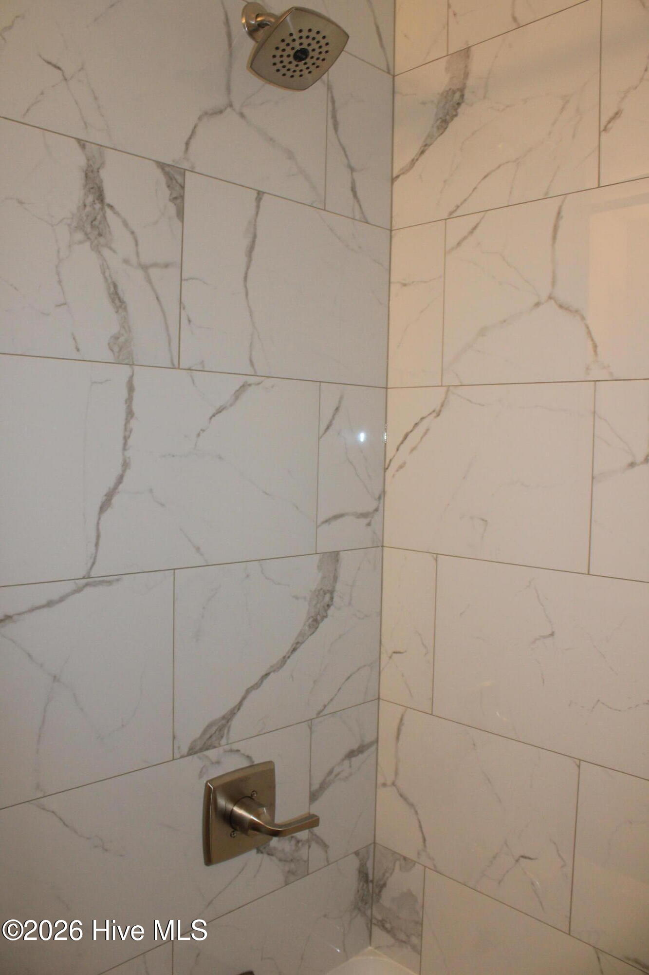 Remodeled bathroom w/ fully tiled shower