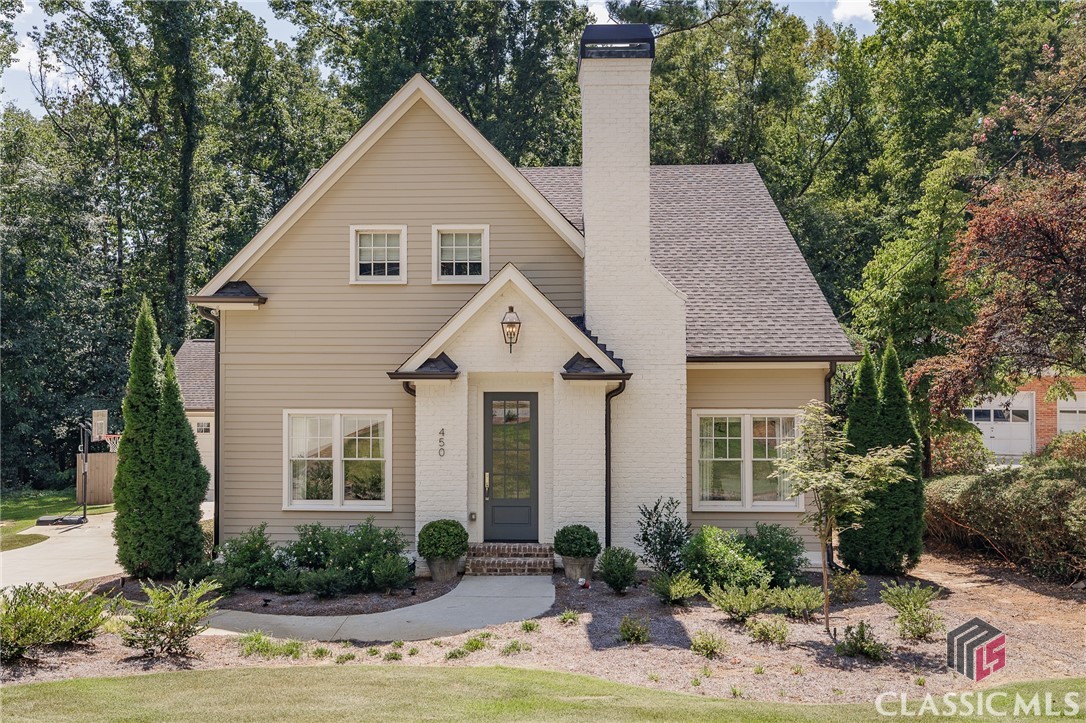 Welcome to 450 Milledge Heights, an exceptional residence located in the heart of Athens, Georgia. This elegant two-story home offers a harmonious blend of modern convenience and classic design. With 4 bedrooms and 4.5 bathrooms, it provides ample space for comfortable family living and guest accommodations. The primary suite, located on the first floor, features a luxurious en-suite bath, walk-in closet, and views of the landscaped backyard. Upstairs, two bedrooms, each with private bathrooms, ensure privacy and comfort. The open floor plan includes a spacious living room, formal dining area, and a cozy family room. The well-appointed kitchen, complete with stainless steel appliances, granite countertops, and an island, is perfect for both everyday use and entertaining. Outdoors, a covered patio overlooks the amazing outdoor living space complete with kitchen, ideal for relaxing or dining al fresco. Additional features include a home office, hardwood flooring, and an attached garage. Situated in the sought-after Milledge Heights neighborhood, this home is conveniently located near schools, shops, dining, and parks, while maintaining a sense of quiet community. 450 Milledge Heights is a rare find, offering both elegance and practicality in a prime location.