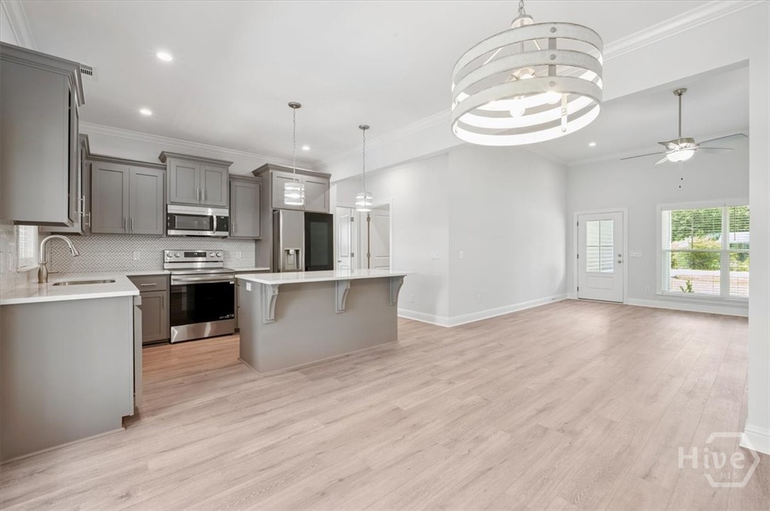 Living room opens to the kitchen and dining room.