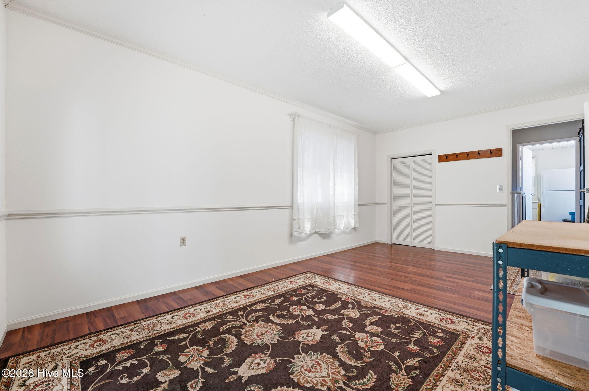 Den and/or recreation room. Door leads to kitchen hallway.