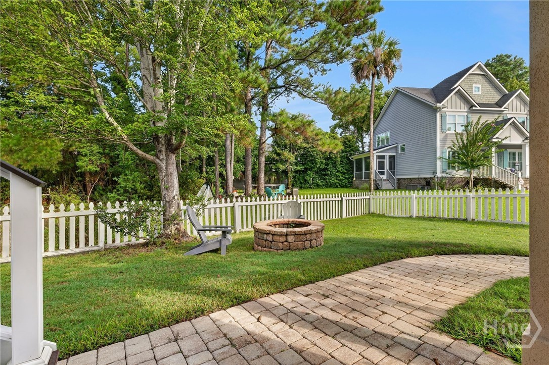 Fire pit within fenced in backyard