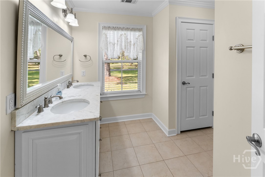 Master bath with double vanity and walk in shower.