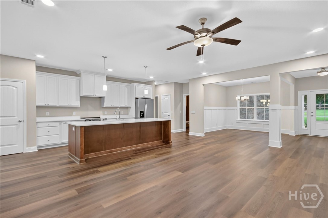 Living room open to kitchen and formal dining view