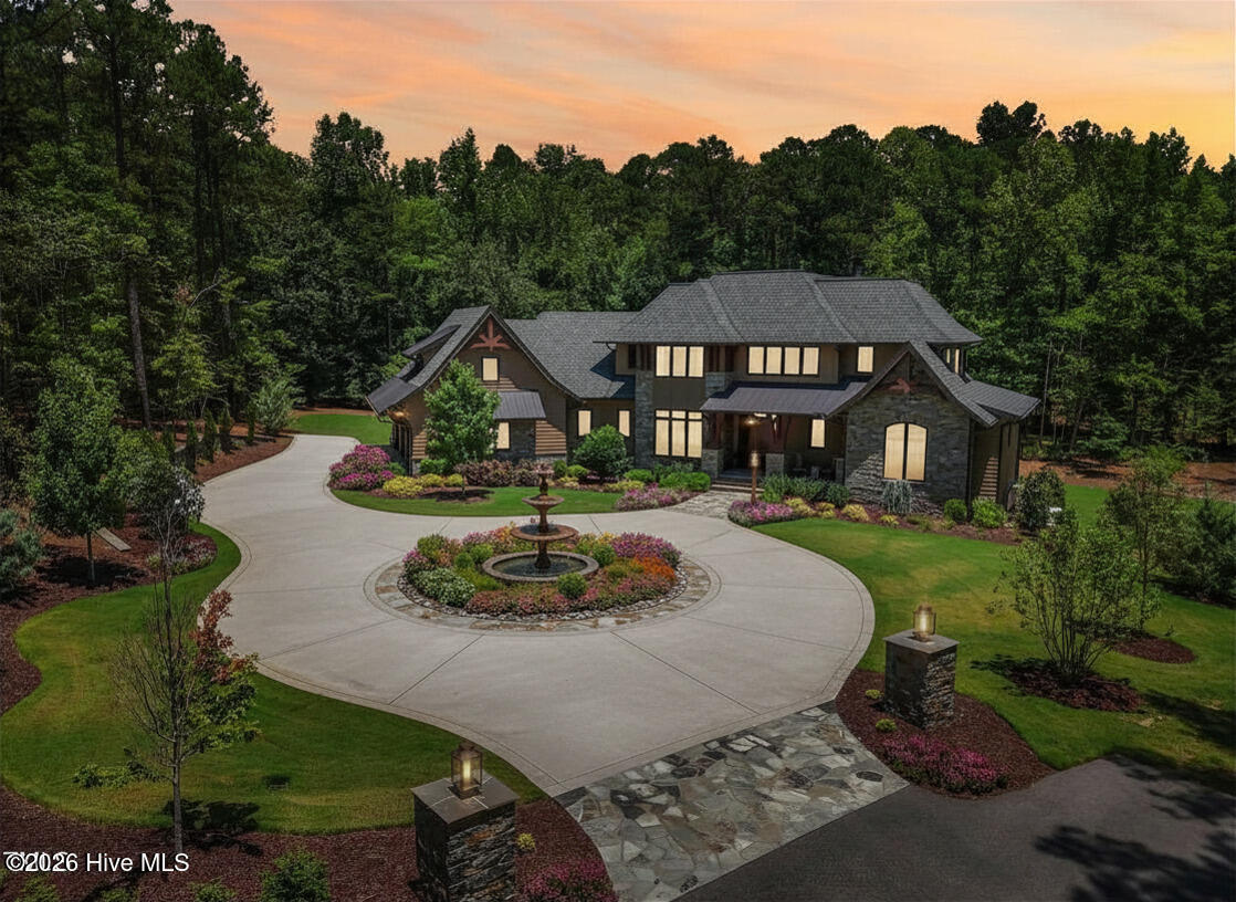 Three-tiered European fountain in Loop driveway
