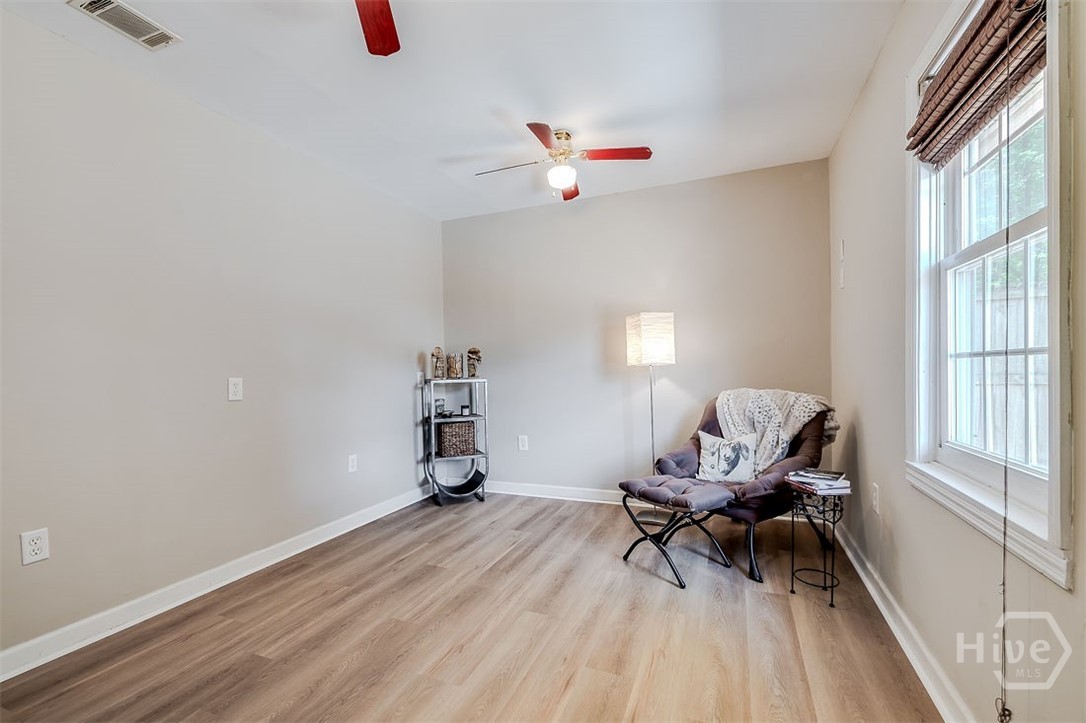 This is the Den/office, which is located on other side of Great room. It could possibly be a guest suite as there is a 1/2 bathroom just around corner and is 12'7 X 10'