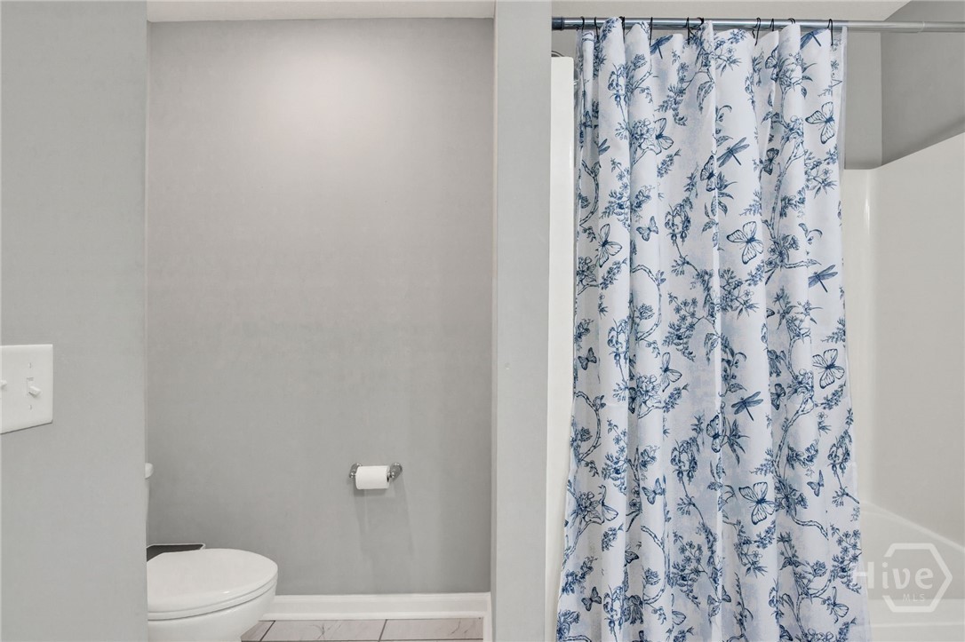 Upstairs Hall Bathroom with Double Vanity and Tub/Shower Combo