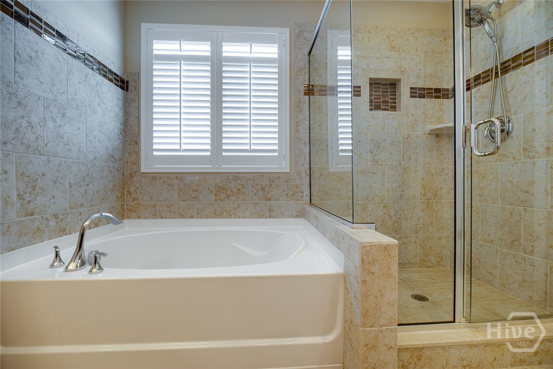 Spa-like feel with custom tile surround and flooring
