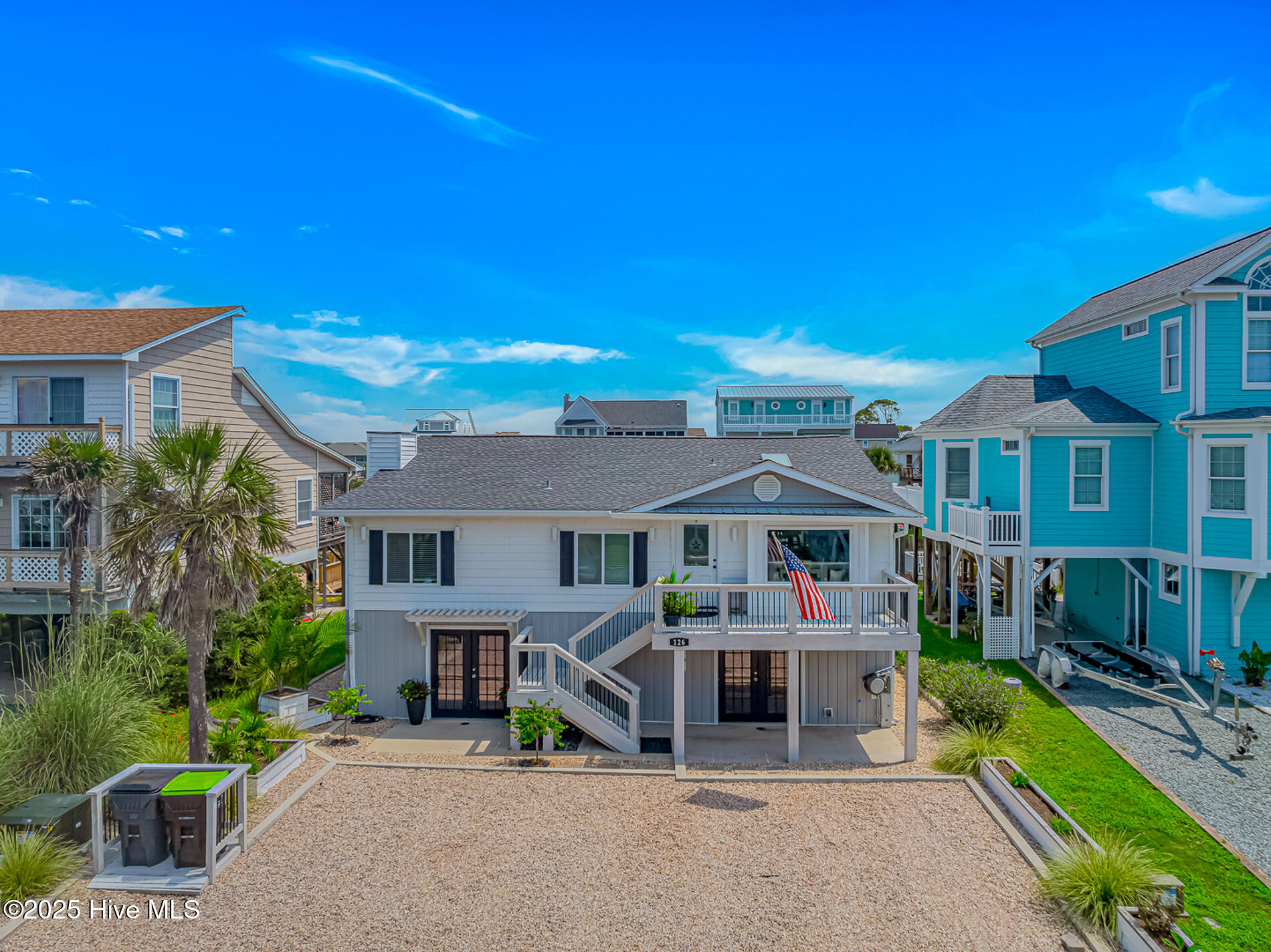 If you have been looking for a gorgeous, remodeled house with direct waterway access as well as quick ocean access, here it is! This home is in immaculate condition and it shows. The home sits on one of the Holden Beach canals with direct deep water access. When you pull up to the home, you'll notice the immediate curb appeal as well as plenty of parking space. Walk inside and you'll see a dining area as well as the very nice upgraded kitchen with plenty of cabinet space, granite counters, backsplash, shiplap ceiling, stainless steel appliances and more! There is also tile flooring throughout the kitchen and living areas. The living room is huge and has plenty of room for hanging out and entertaining. Each bedroom has its own bathroom which is optimal for rentals, and just adds to the potential to generate maximum income with this home! Two of the bathrooms have been updated with new vanities, fixtures and beautiful tiled showers as well. The third bedroom downstairs is tiled and has its own private bathroom. Walking outside, there is a large back deck up top overlooking the boat dock and canal as well as a lower deck for relaxing and enjoying the beautiful weather. The downstairs area towards the back has been renovated and makes a nice man cave, entertainment area and extension of your outdoor living area. The bottom part of the home towards the front is used for storage and has a ton of room! This could easily be made into more living space to maximize occupancy and rental potential if one wanted. Out back, there is a nice area for grilling as well as a fire pit area. The seller has left no stone unturned on this home. Even the custom light switches in this home are updated. All that this home is missing is you, and your boat. You have a private dock, a private lift and very quick access directly to the Intracoastal Waterway and as well as a short ride to the ocean! Do not miss out on this home, schedule a showing today!