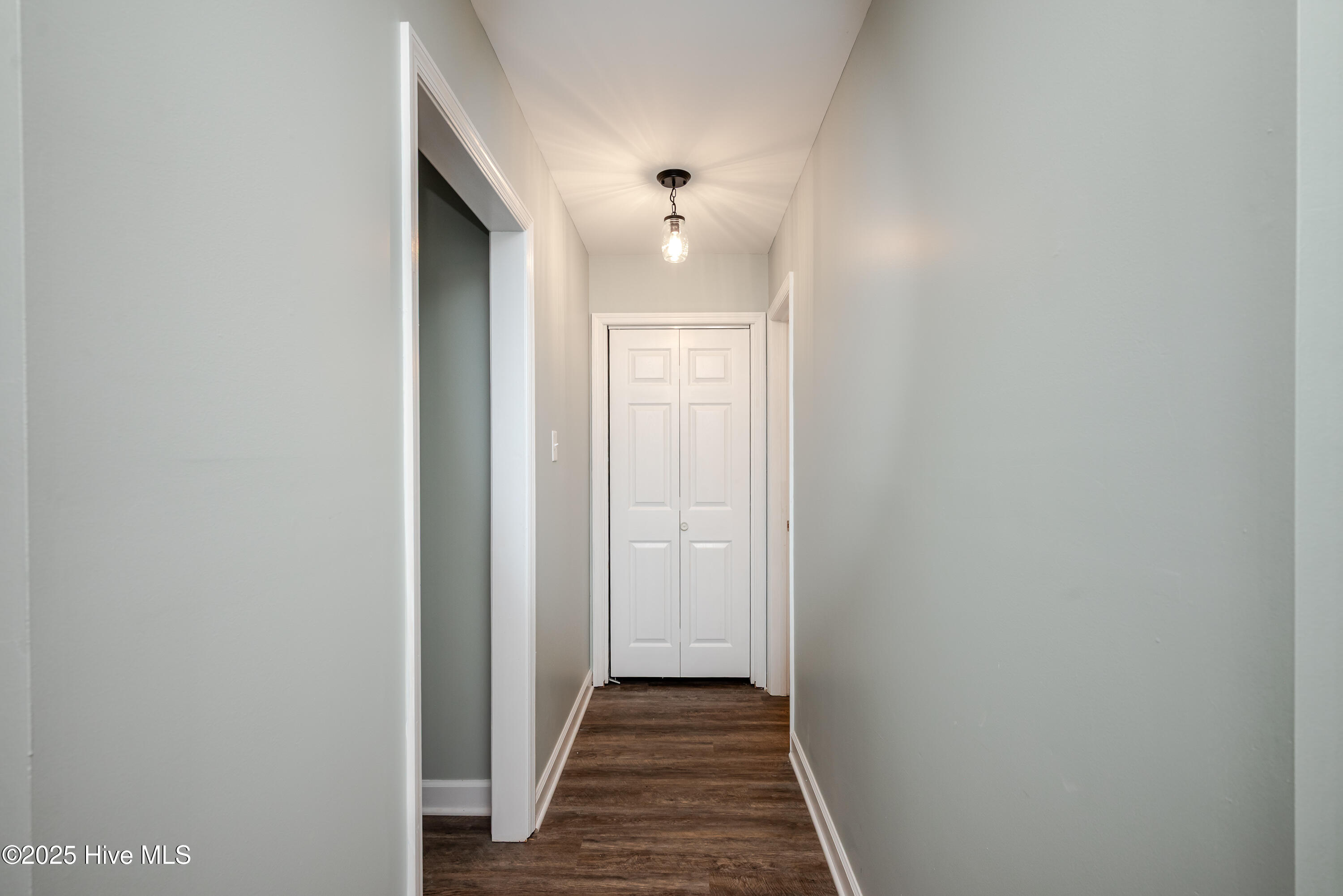 hallway to 3 stall garage