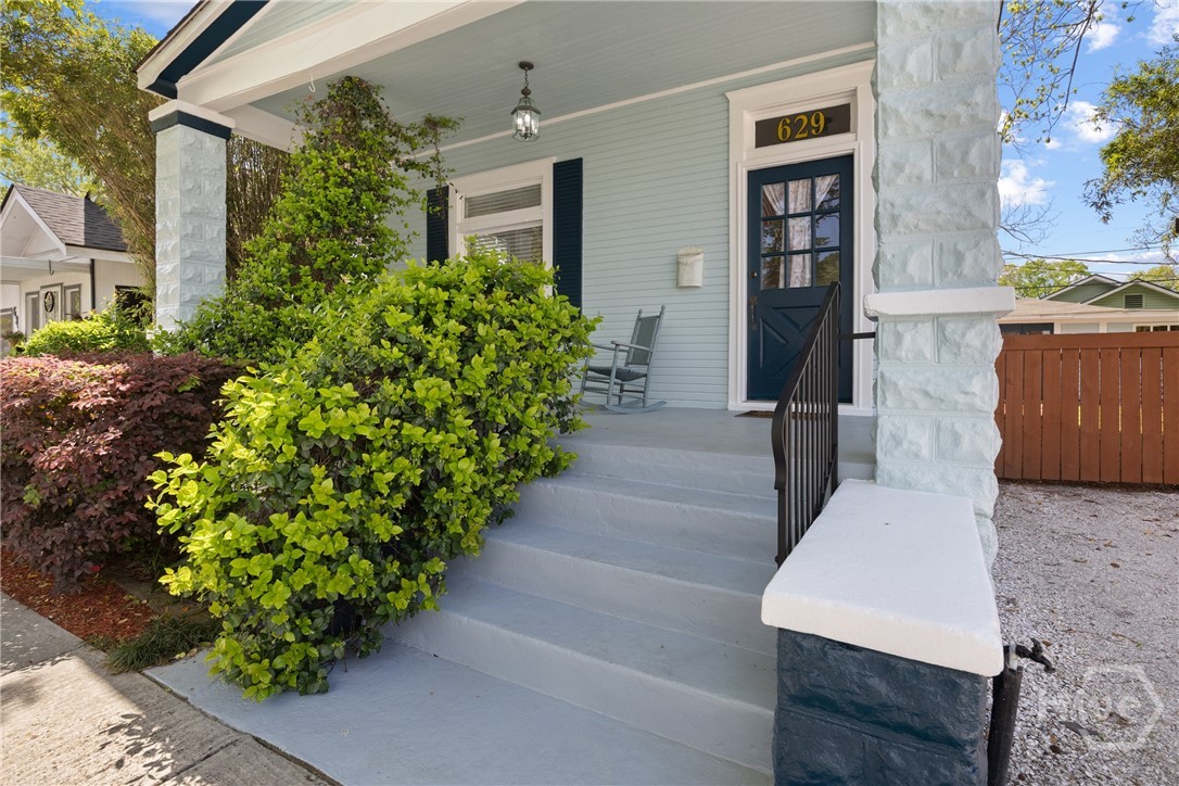 Covered front porch with original architectural details