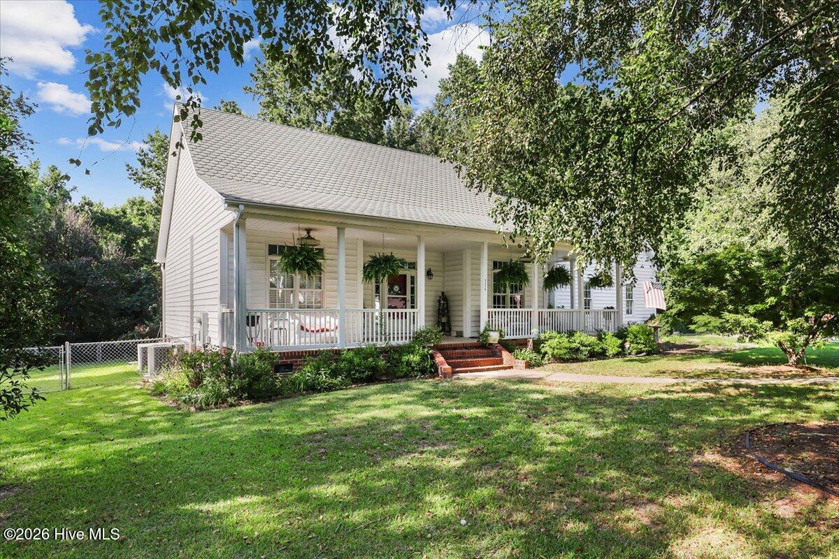 Tucked away on nearly 6 acres at the end of a peaceful cul de sac, this 4 bedroom, 3 bath home blends natural warmth with modern livability. Pine cathedral ceilings add character throughout, while the screened porch and back patio invite you to slow down and savor the quiet. The kitchen's oversized island is the heart of the home, perfect for cooking, gathering, or entertaining. A lofted outbuilding expands your possibilities--storage, studio, workshop, you name it. A private retreat that's truly move in ready. Call today for a private tour!