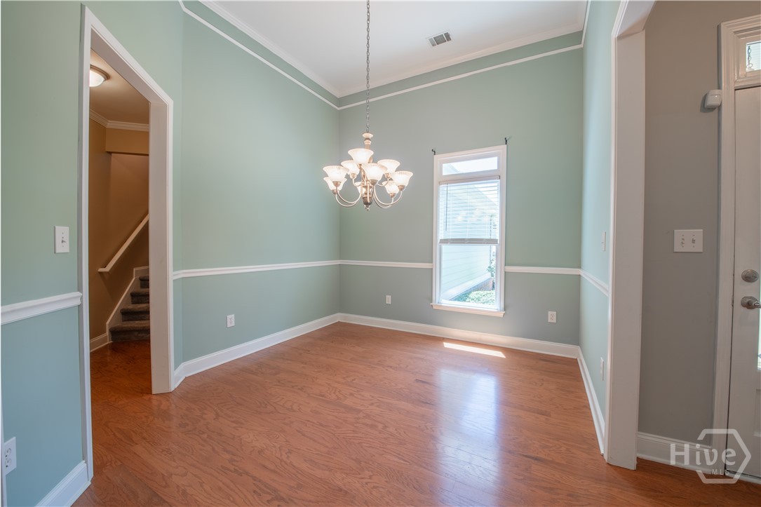 Formal Dining Room by front door opening to Living Room