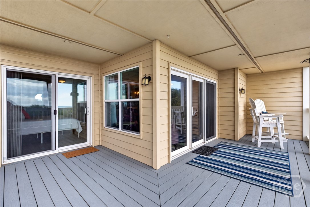Primary BR and living room open up to the wraparound porch