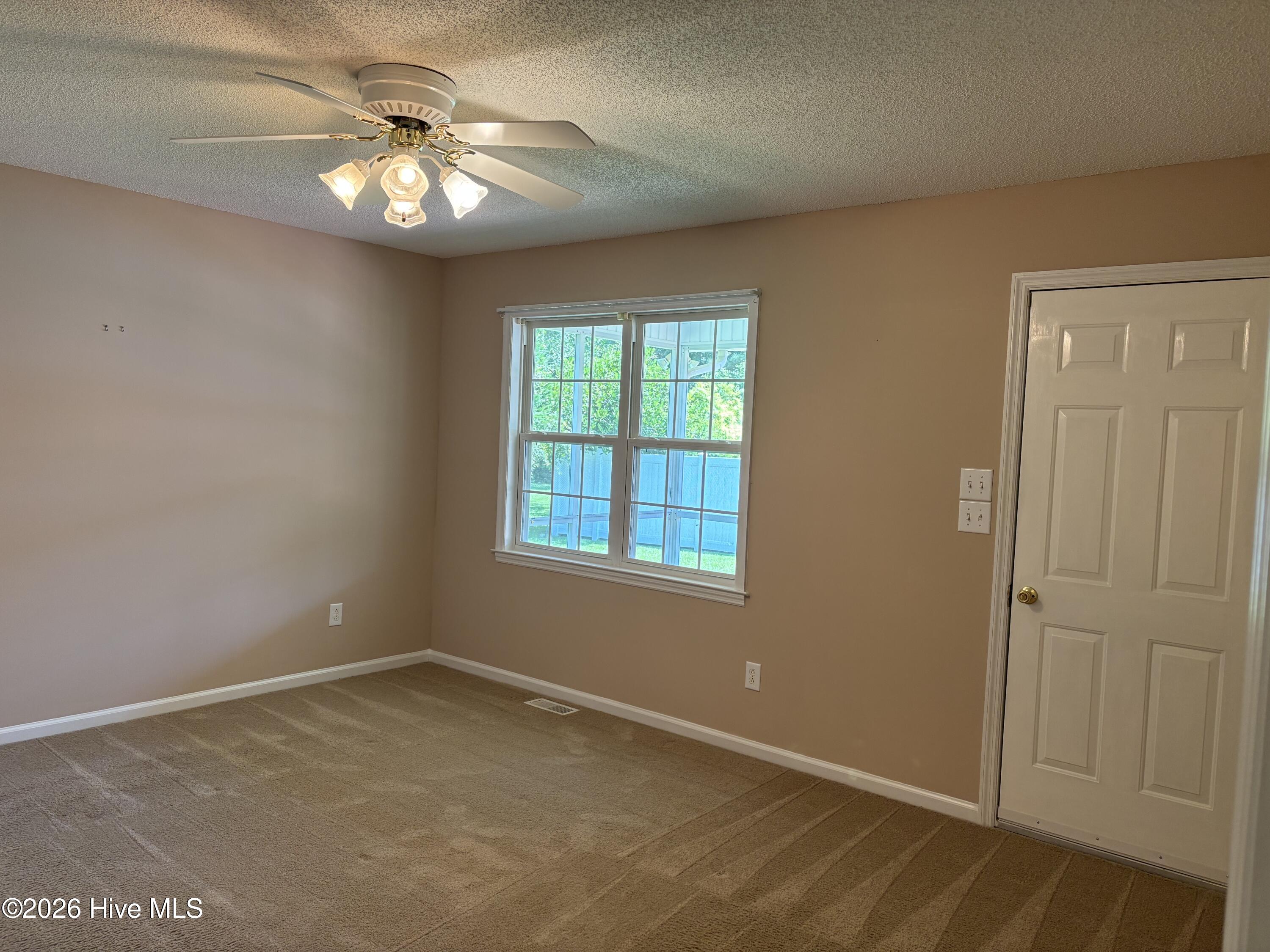 Main bedroom has door to screened porch
