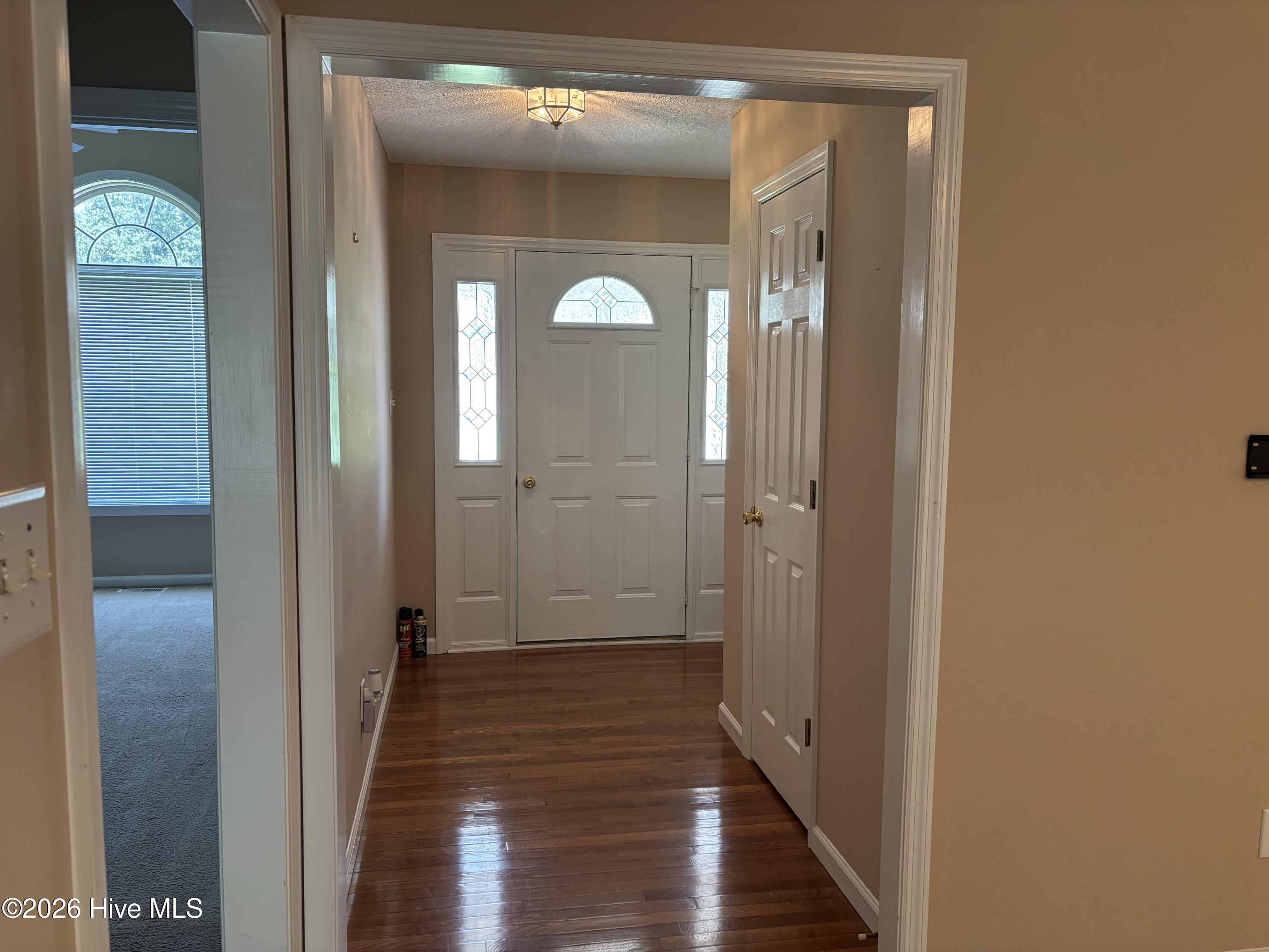 Front entrance with shiny hardwood floor