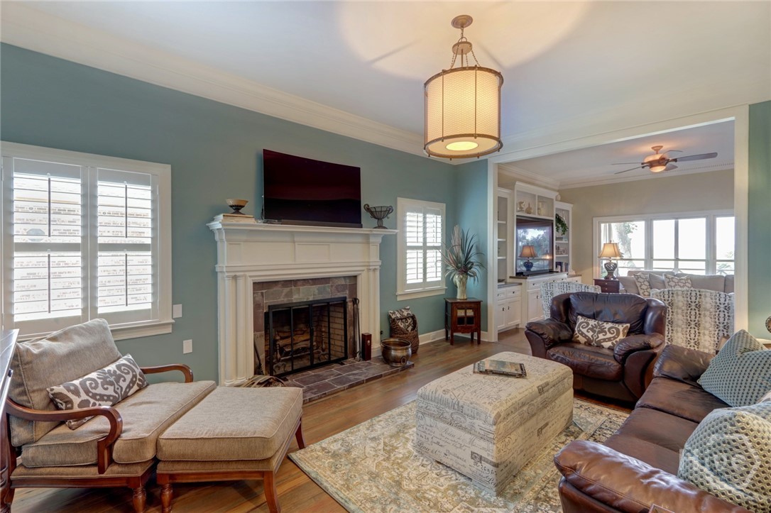 Den with fireplace off living room