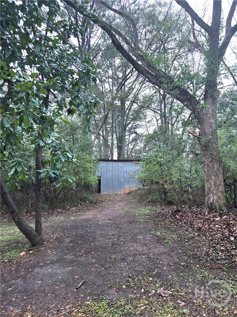 View of the back of the property with the outbuild