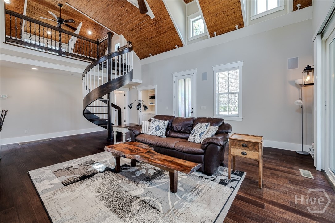 Spiral staircase leads to cottage loft