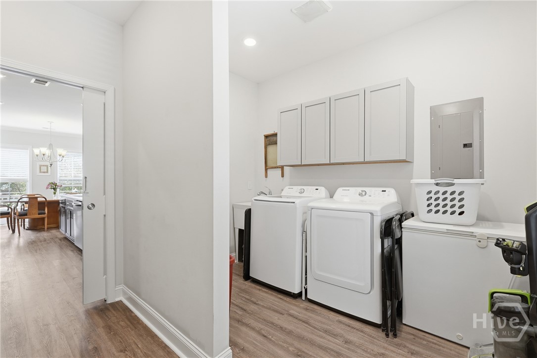 laundry room is tucked in behind walk in pantry