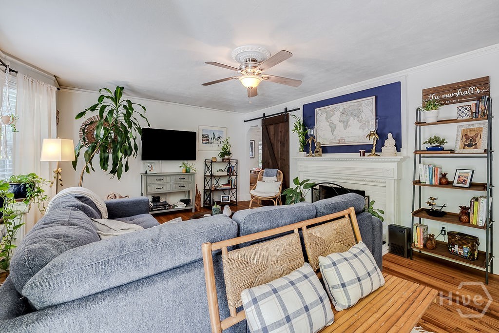 Spacious living room with gas fireplace and ample natural light.