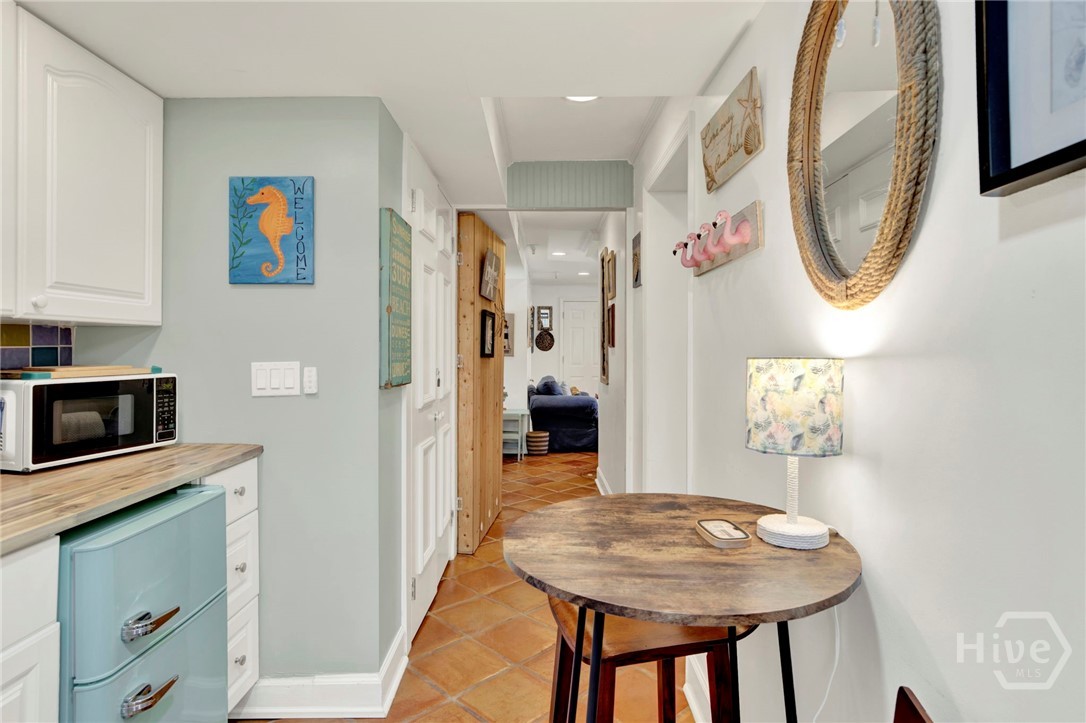 false wall opens to common area/ den that ties the