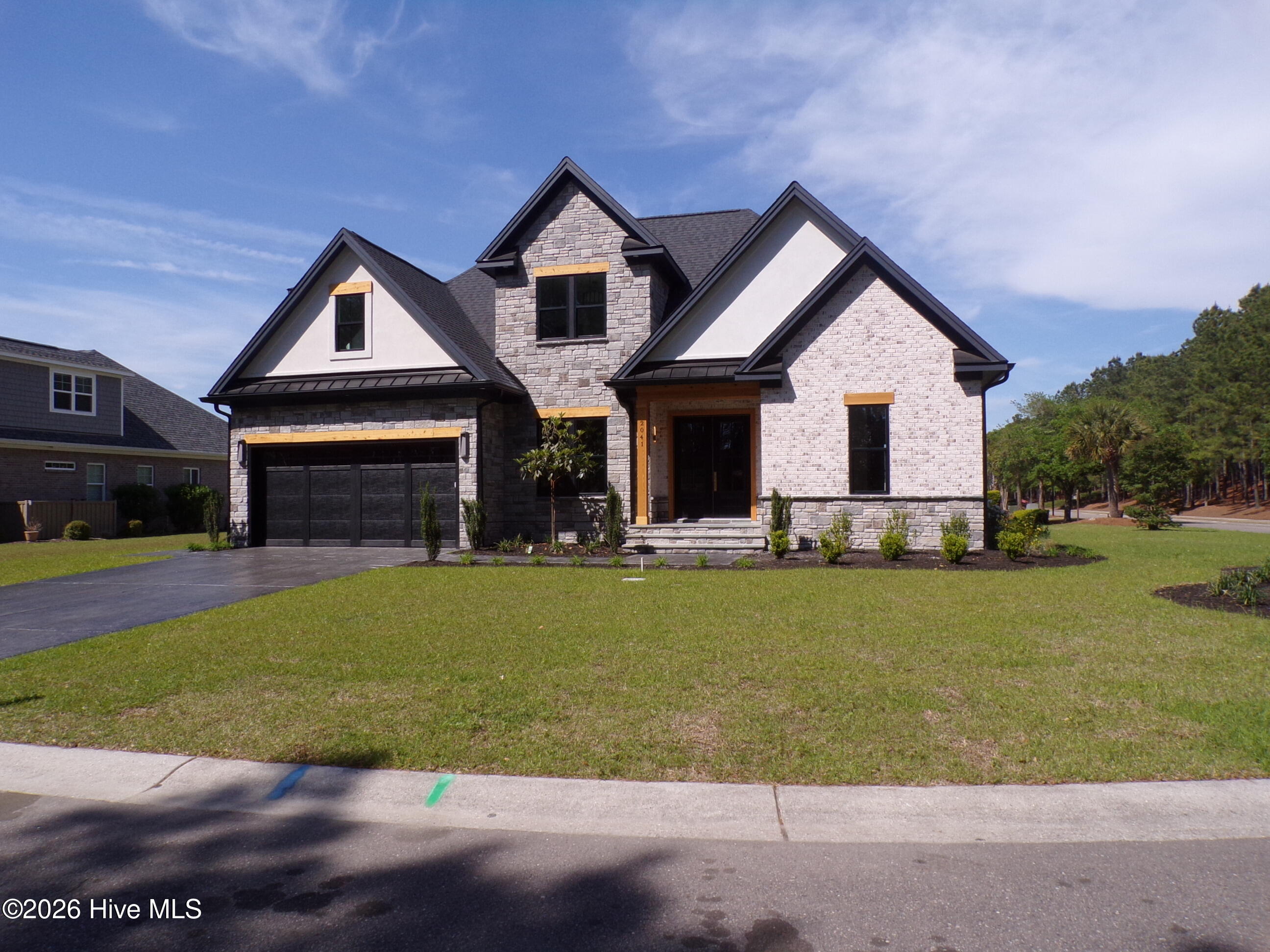 Custom Contemporary 4Bdr/2.5 Bath home in the desirable Resort Style Community of  Waterford of the Carolinas. This 2 story Multi textured beauty with Custom appointments is sure to excite the senses. Open and inviting spaces, complimented by custom lighting, cabinetry, & colors will turn everyday living into an absolute dream. Relax and enjoy water views from the Sunroom, or step outside and take in the cool breezes from one of Waterford's many waterways & canals with friends & family. This beautiful  new construction allows for peace of mind and turnkey living. An absolute GEM! A must see for sure!