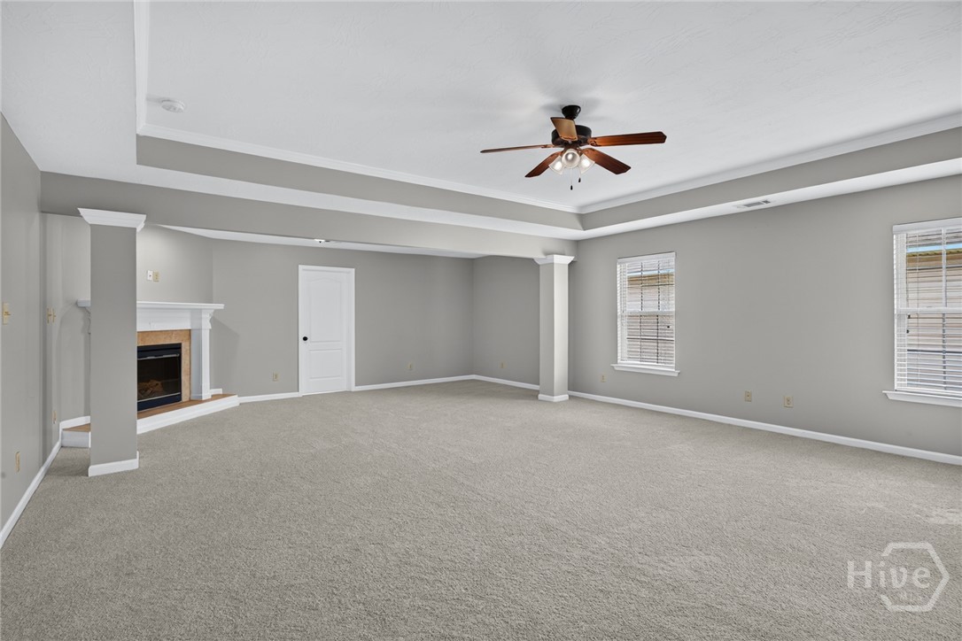 Primary suite with sitting area and fireplace