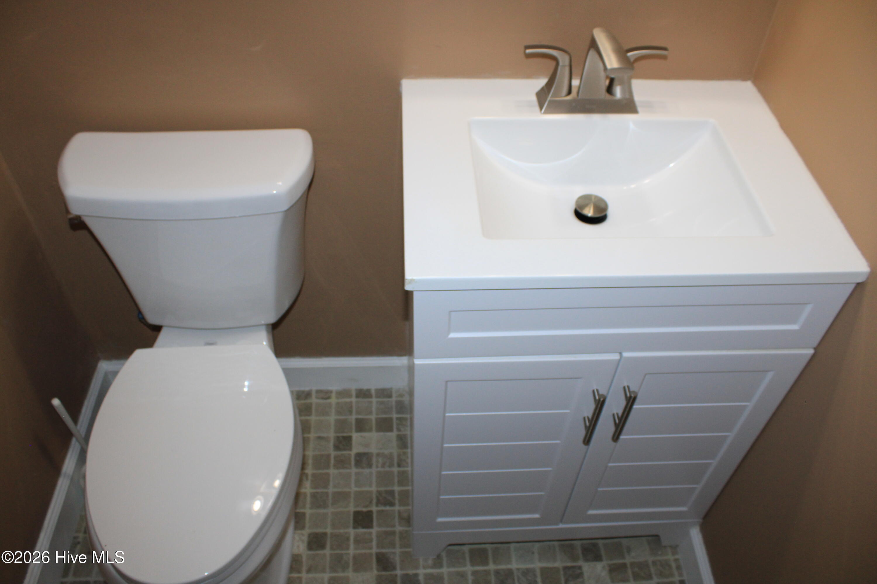 Half Bath w/Luxury Tiled Flooring and New Vanity