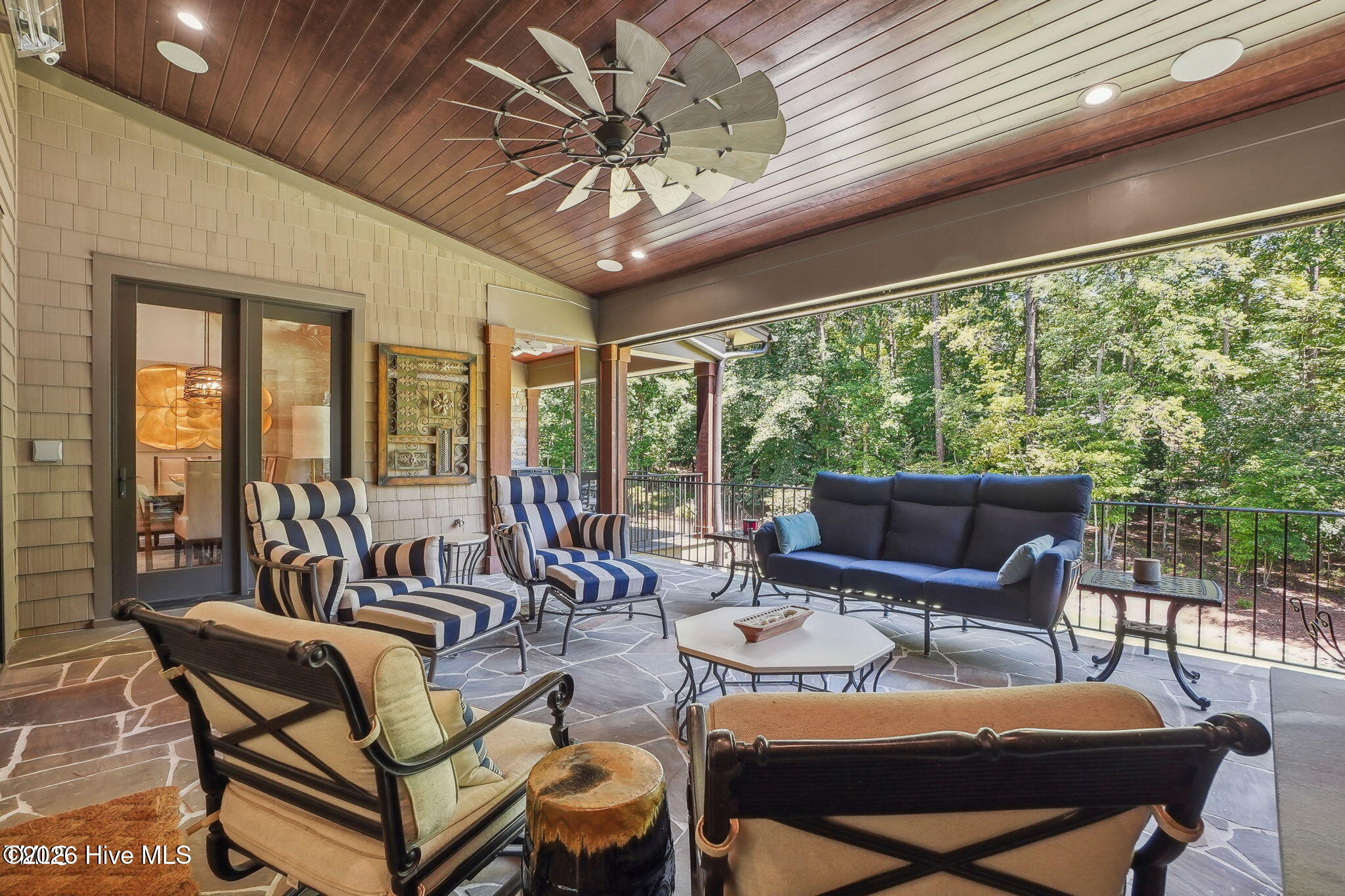 Back wall of screen porch has retractable phantom executive screen that retracts into the ceiling wh