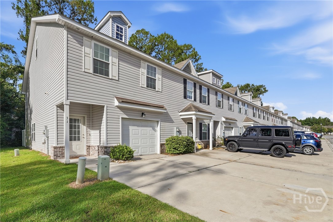 Featuring a 1-car garage and two assigned parking paces at the front of the property.